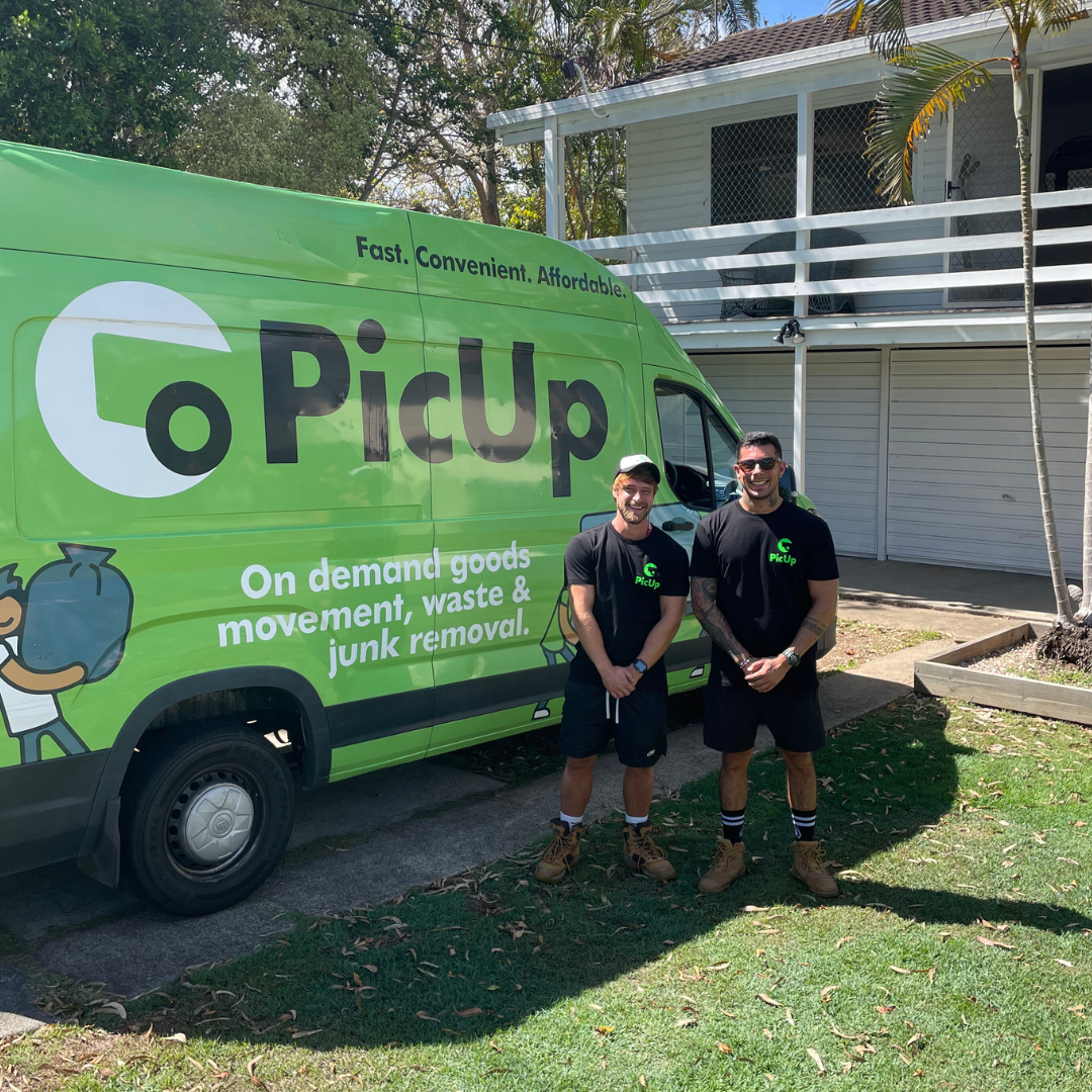 A PicUp driver loading furniture into a branded van